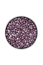 Top view of an open canister of Satin Smooth Depilatory solid wax bean featuring purple wax granules